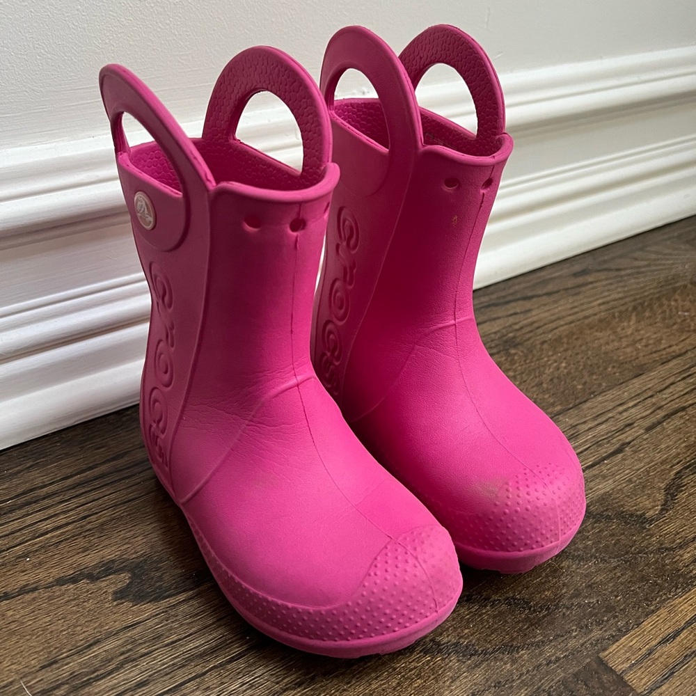Pink rain boots by Crocs